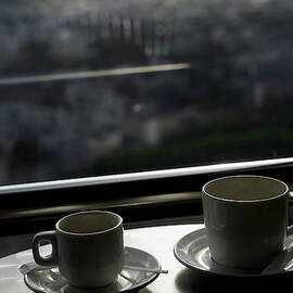 Two Empty Coffee Cups On A Table by Ron Koeberer