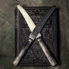 two knives and a book by Joana Kruse