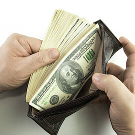 Wallet Containing 100 Us Dollar Banknotes by Science Photo Library