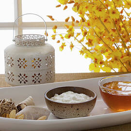 Yogurt And Honey On A Tray In A Spa by Juan Silva