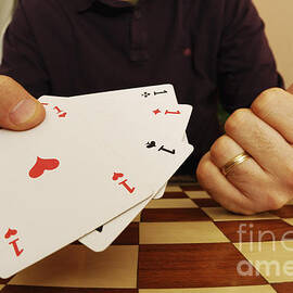  Four aces in hands by Sami Sarkis Photography