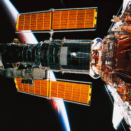 A Satellite Docked On The Space Shuttle by Stockbyte
