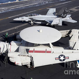 An E-2c Hawkey And An Fa-18 Super by Gert Kromhout