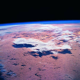Clouds Above The Earth Viewed From A Satellite by Stockbyte