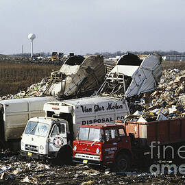 Dumping Garbage In Landfill by Roger A. Clark
