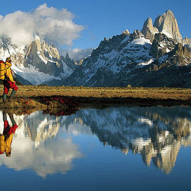 Hiker, Cerro Torre And Fitzroy by Colin Monteath