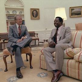 Jimmy Carter Chatting With Hank Aaron by Everett