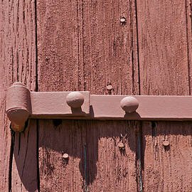 Painted Red Iron Hinge on a Red Barn Door