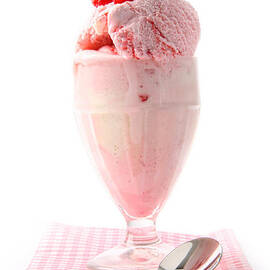 Raspberry sundae with napkin on white  by Sandra Cunningham