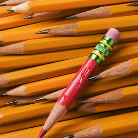 Red pencil with yellow ones by Garry Gay