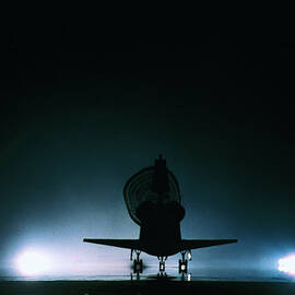 The Space Shuttle Landing With Its Drogue Parachute Deployed by Stockbyte