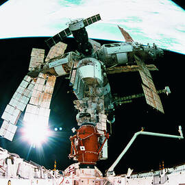 View From A Wide Angle Lenses Of A Space Station Docking In Orbit by Stockbyte