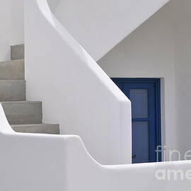 White stairs and blue door by Sami Sarkis Photography