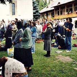 Worshipers at Sihastria Monastery by Sarah Loft