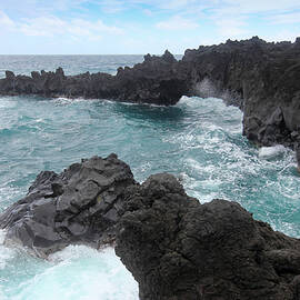 A View of Churning Waves and Spray at the Sea Arches, Waianapana by Derrick Neill