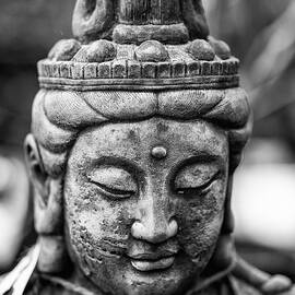 Beautiful Buddha statue portrait with shallow depth of field for by Matthew Gibson