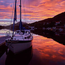 Beautiful sunset at the Norwegian fjord,  yachts in port  by Sergey Pro