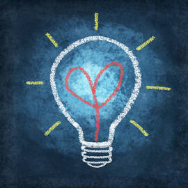 heart in light bulb by Setsiri Silapasuwanchai