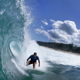 Jack Johnson surfing in Hawaii.  by Sean Davey