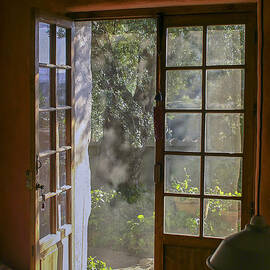 Open door with sunlight by Patricia Hofmeester