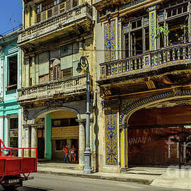Red truck on the street of Havana, Cuba. by Viktor Birkus