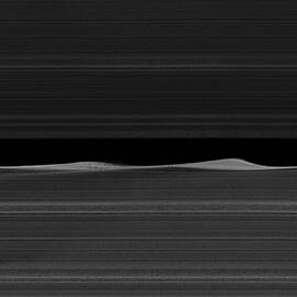 Saturn's Moon Daphnis in the Keeler Gap by Eric Glaser