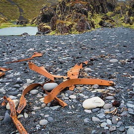 Shipwreck pieces in Iceland Dritvik pebbled beach by Matthias Hauser