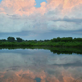 Sunset on Storm Clouds Reflecting in Sullivan Lake by Ray Mathis