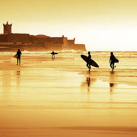 Surfers silhouettes by Carlos Caetano