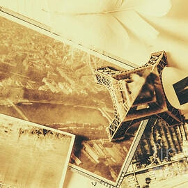 Toned Image Of Eiffel Tower And Photographs On Table by Jorgo Photography