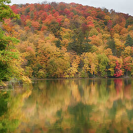 Vermont fall foliage reflected on Pogue Pond by Jeff Folger