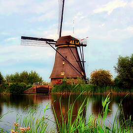 windmill and canal - the netherlands by Mountain Dreams
