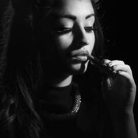 Woman Applying Lipstick - Black and White Version by Amanda Elwell