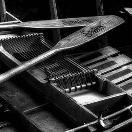 Wooden Rowboat And Oars In Black And White by Carol Montoya