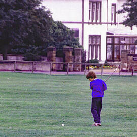 Young Lad Practicing on town Green by Imagery-at- Work