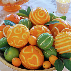 Carving Patterns In Oranges And Limes by Friedrich Strauss