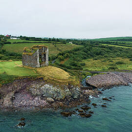 Aerial view of the Minard Castle situated on the Dingle Peninsula in Ireland by Miroslav Liska