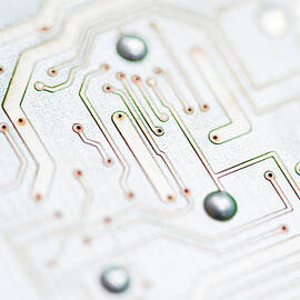 Close-up Of A Circuit Board by Nicholas Rigg