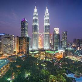 Kuala Lumpur, Malaysia Park And Skyline by Sean Pavone