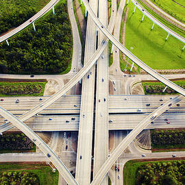 Aeirial View Of Traffic And Overpasses by Thomas Northcut