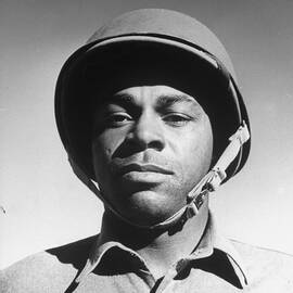 An African American soldier serving in the US Army. by Charles E. Steinheimer
