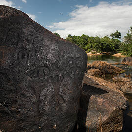 Ancient Petroglyphs On Rock Boulder By Essequibo River