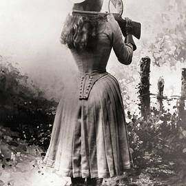 Annie Oakley Shooting Over Shoulder by Bettmann