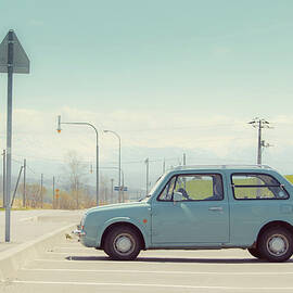 Aqua Color Car In Parking Lot by D3sign