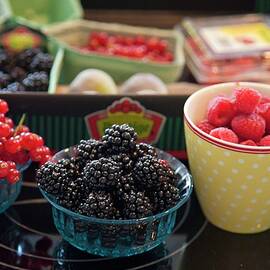 Assorted Berries In Bowls And Packaged In A Crate by Studio Lipov
