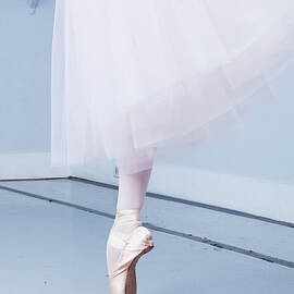 Ballerina On Pointe Low Angle View by Jonya
