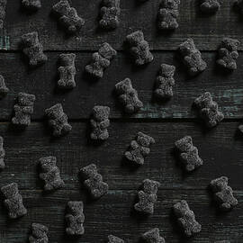 Black Gummy Bears On Wood by Westend61