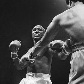 Boxer Joe Louis Wearing Boxing Gloves Framed Print by Bettmann