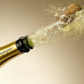 Champagne And Cork Exploding From Bottle by Andy Roberts