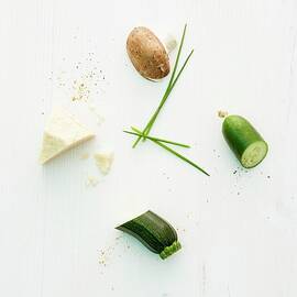 Cheese, Courgette, Cucumber, Mushroom And Chives In The Form Of A Clock by Michael Wissing